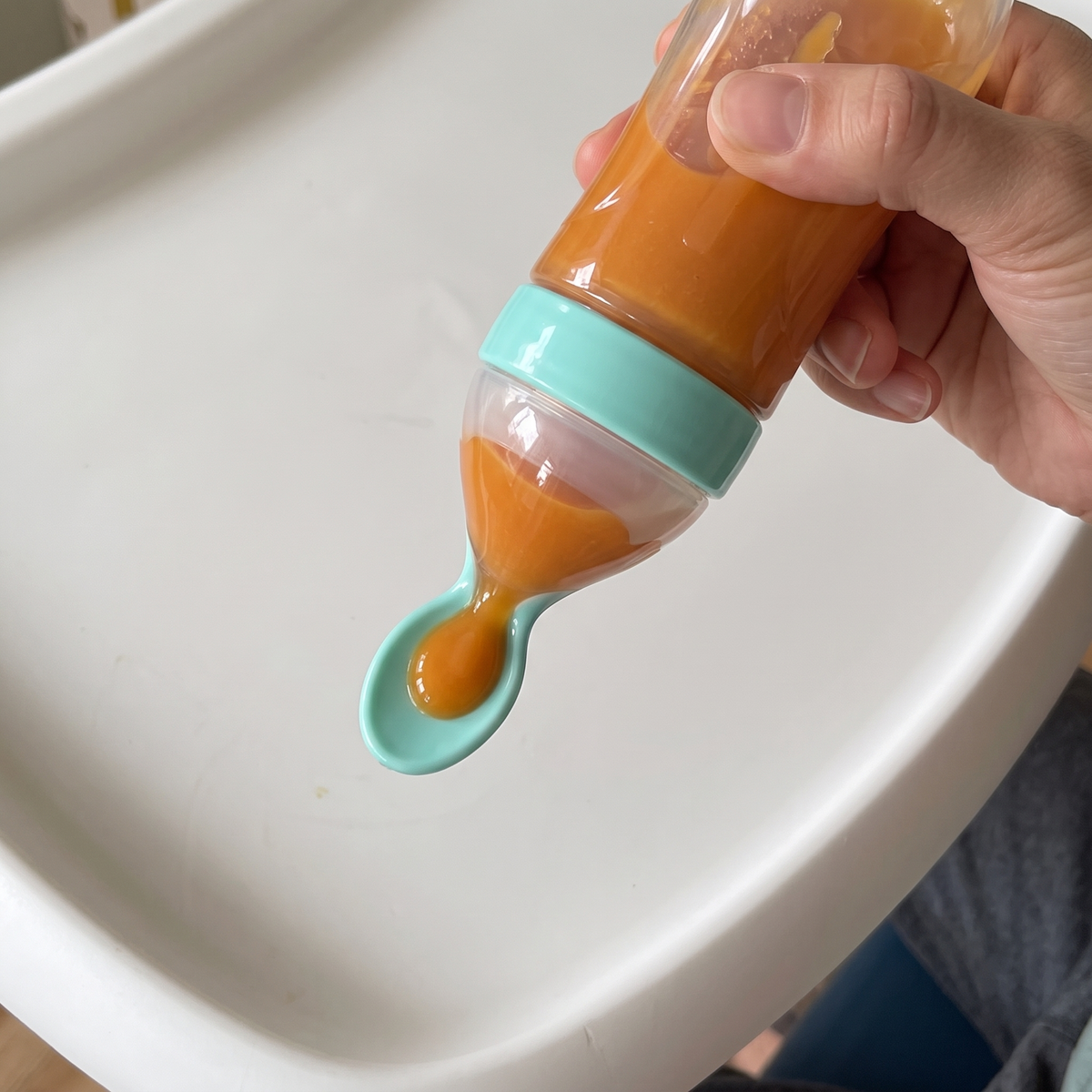 Squeezing puree onto the spoon tip